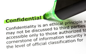 The word CONFIDENTIAL highlighted in green with felt tip pen